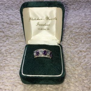 Silver ring with purple and blush stones.